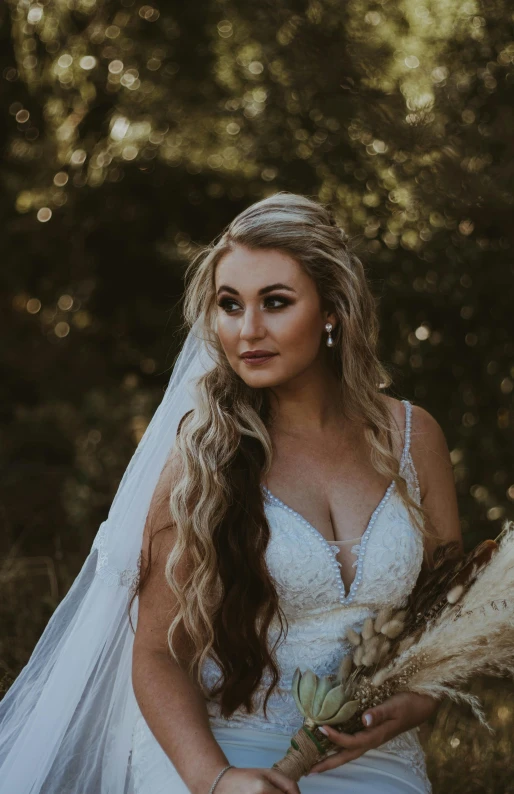 a woman in a wedding dress holding a bouquet, sweeping wild blonde hair, portrait featured on unsplash, cinematic outfit photo, looking to his side