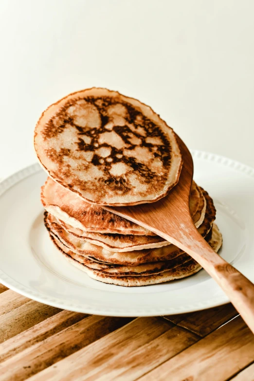 there are pancakes that are stacked on top of the plate