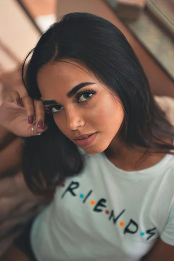 a woman wearing a t - shirt that says friends, trending on pexels, olive skin, russian girlfriend, bedroom eyes, multi colored