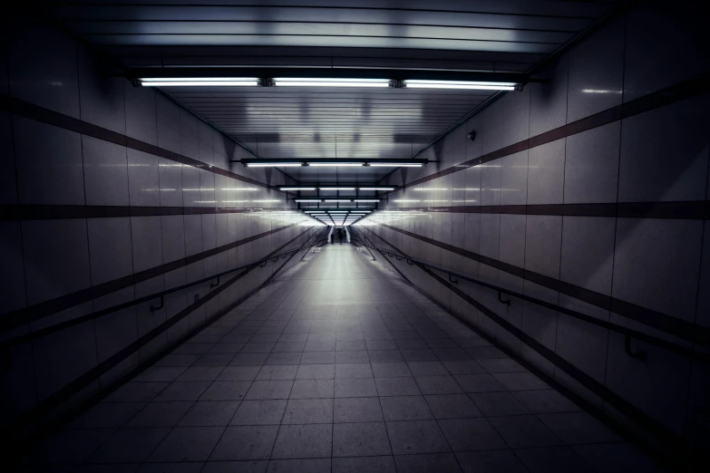 a long hallway with a light at the end of it, an album cover, unsplash, postminimalism, dark futuristic, london underground tube station, the scary empty liminal spaces, alessio albi