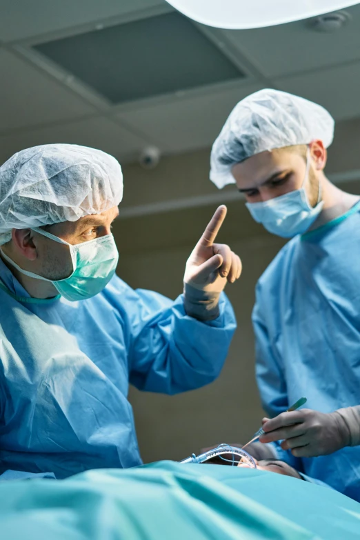 two surgeons working on a patient in an operating room, an album cover, by Adam Marczyński, shutterstock, 2717433015, controversial, small in size, [ cinematic