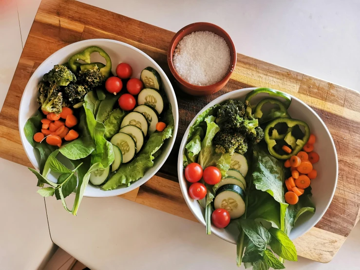 two bowls of vegetables on a cutting board, pexels contest winner, lush greens, highly upvoted, glazed, regular build