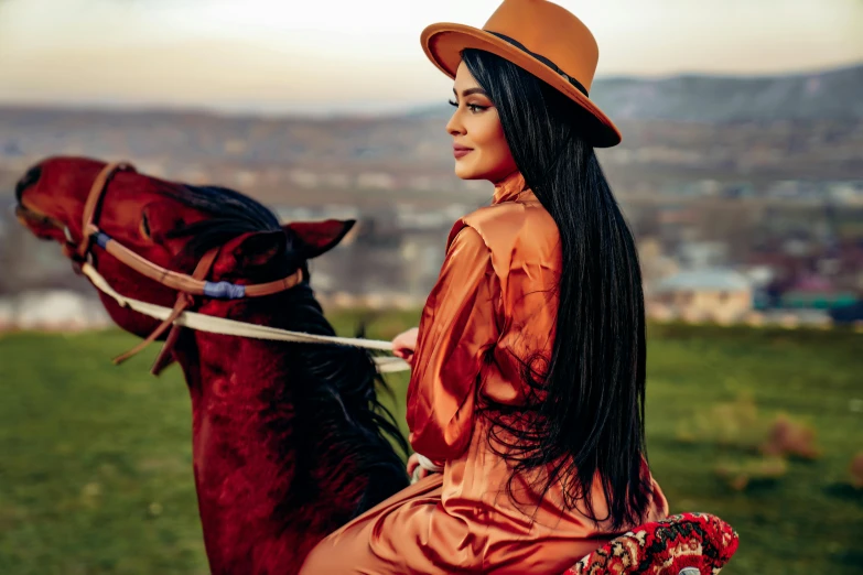 a woman riding on the back of a brown horse, an album cover, trending on pexels, beautiful iranian woman, silk hat, romanian, orange hue