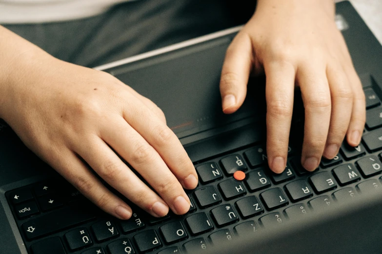 a close up of a person typing on a laptop, by Carey Morris, worksafe. instagram photo, thinkpad, schools, bumps