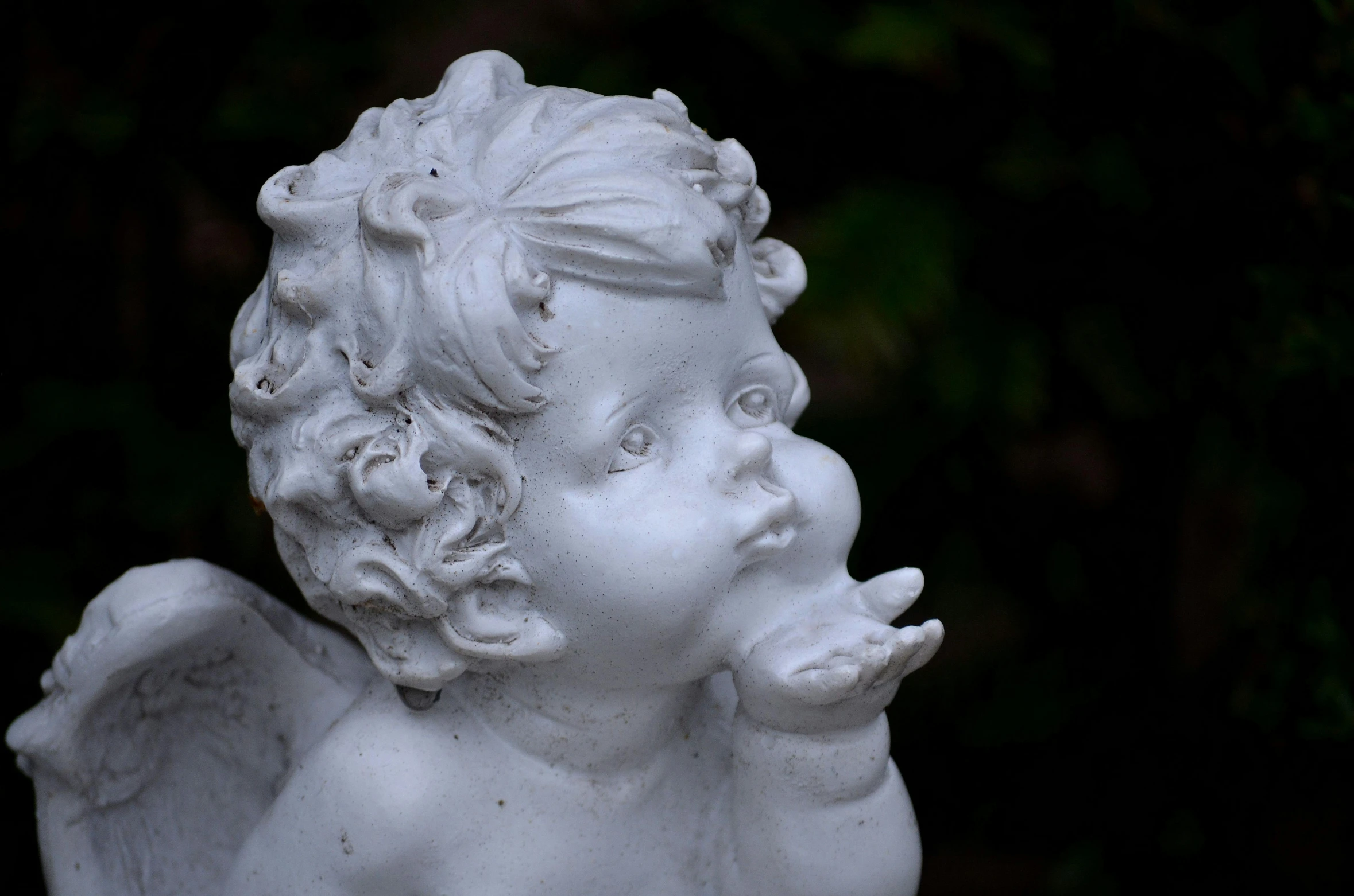 a statue of an angel blowing a kiss, inspired by Margaret Brundage, pixabay contest winner, albino dwarf, high angle close up shot, taken in 2 0 2 0, today\'s featured photograph 4k