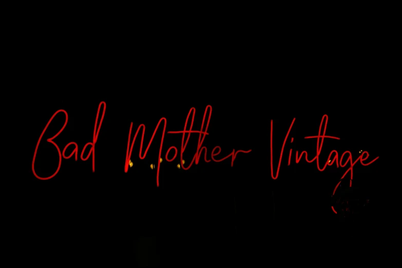 a neon sign that says bad mother vintage, an album cover, by Fred Mitchell, header, witchy clothing, lightpainting luminescent, redlettermedia