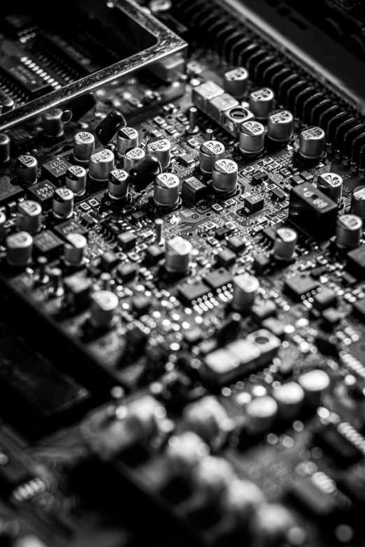 a black and white photo of a computer motherboard, by Jacob Toorenvliet, audio equipments, by greg rutkowski, digital image, portrait of computer & circuits