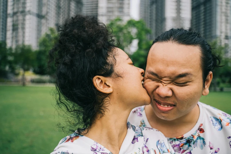 a man giving a woman a kiss on the cheek, pexels contest winner, happening, sydney park, siamese twins, lee griggs and jason chan, bbwchan