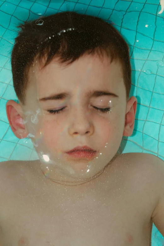 a young boy taking a bath in a pool, an album cover, by Lee Gatch, pexels, bubblegum face, breath condensation, face mask, ignant