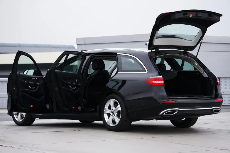 a mercedes benz c class with a open trunk