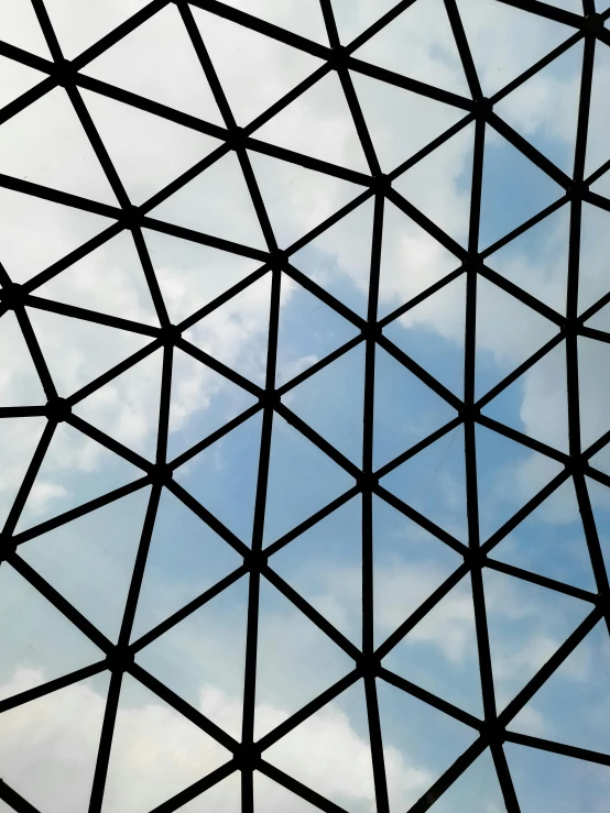 a close up of a metal structure with a sky in the background, inspired by Buckminster Fuller, unsplash, visual art, photo on iphone, the british museum, tiled, square