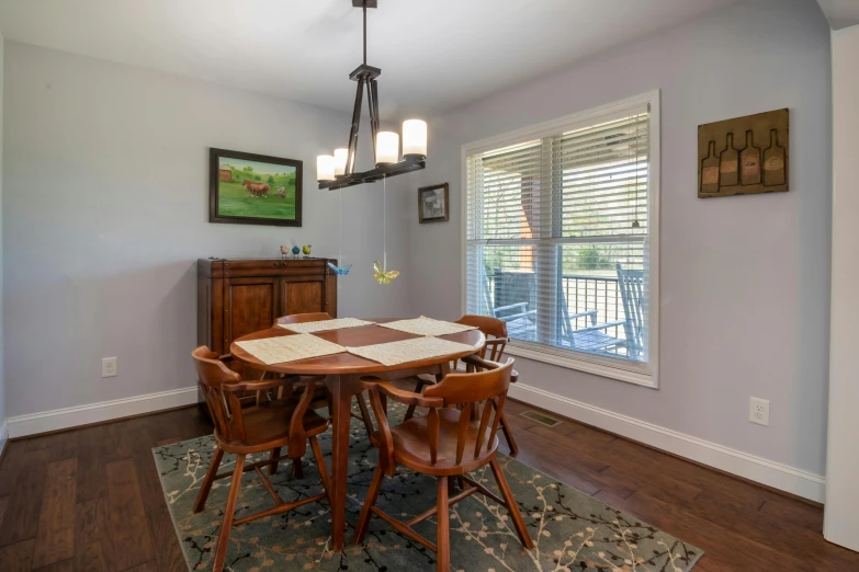 the formal dining room has an antique table