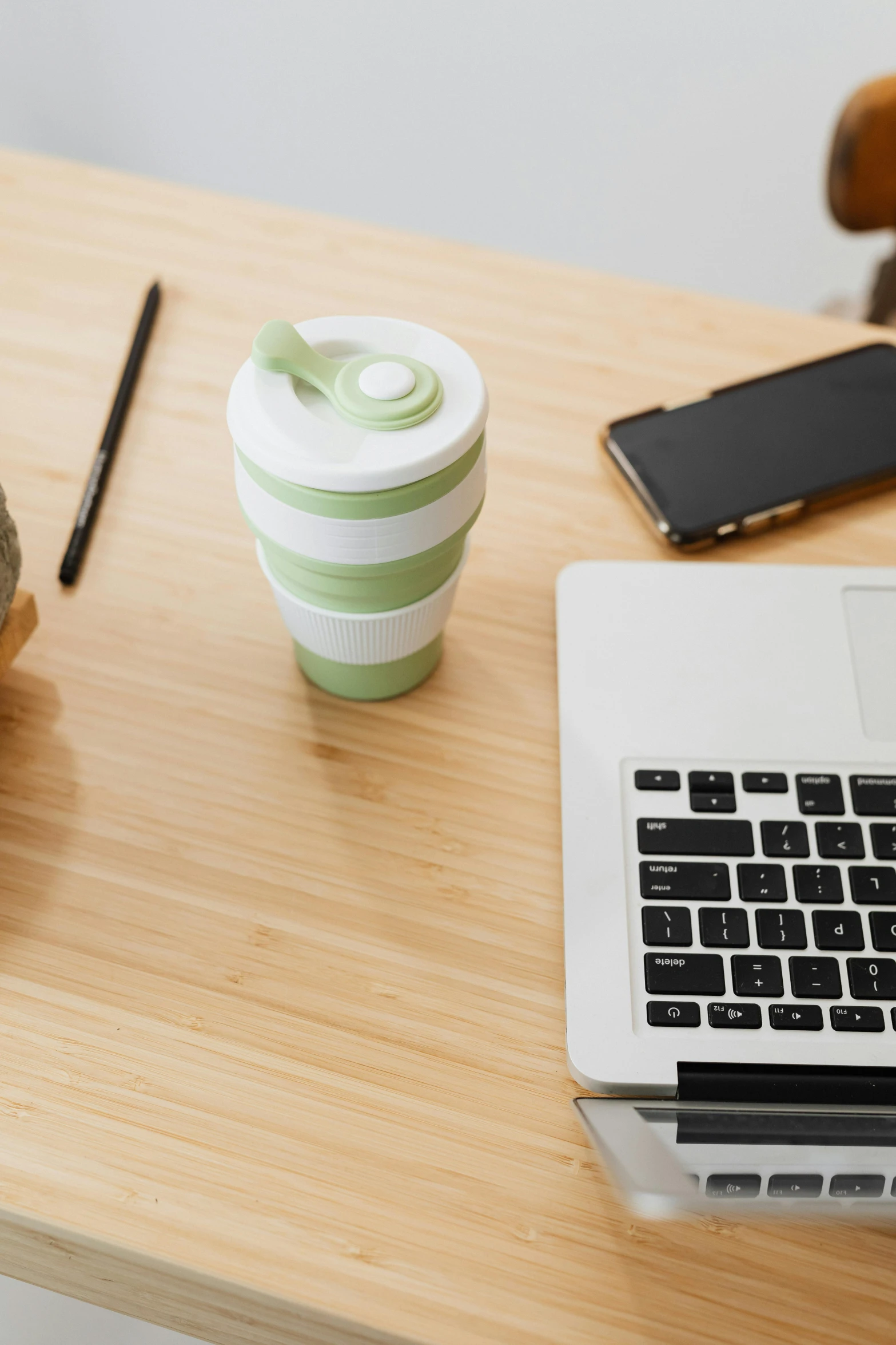 a laptop computer sitting on top of a wooden desk, paper cup, made of bamboo, 9 9 designs, product image