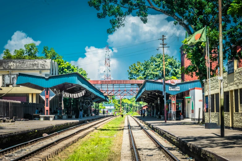 a train station with a train on the tracks, hurufiyya, assamese aesthetic, thumbnail, fan favorite, ground level view of soviet town