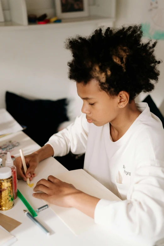 a little girl that is sitting at a table, a child's drawing, by Daniel Seghers, pexels contest winner, black teenage boy, coloring book style, caligraphy, mate painting