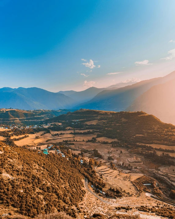 a view from the top of a hill looking out at a town