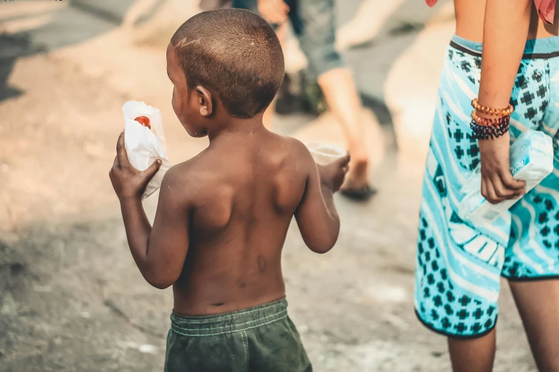 a little boy that is standing in the dirt, pexels contest winner, happening, people outside eating meals, standing in a township street, of a shirtless, 15081959 21121991 01012000 4k