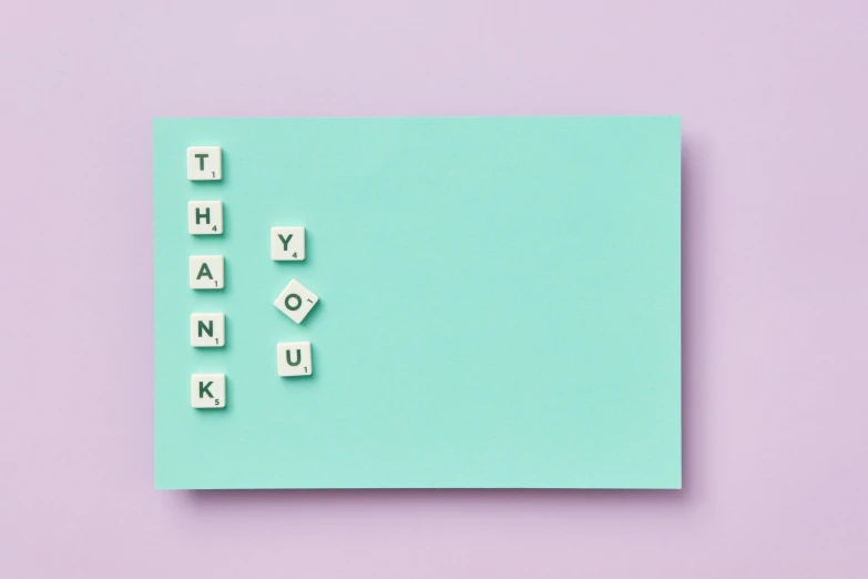 a piece of paper with the word thank written on it, by Emma Andijewska, trending on unsplash, letterism, squares, pastel green, mauve and cyan, society 6