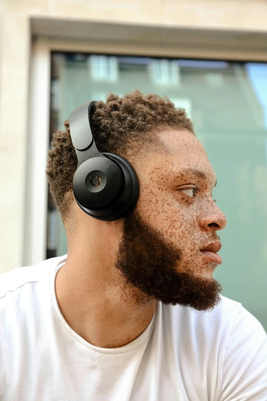 a man with a beard wearing a pair of headphones, nba, with textured hair and skin, curated collections, multi-dimensional