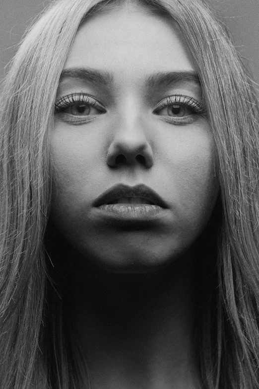 a black and white photo of a woman with long hair, inspired by Louisa Matthíasdóttir, unsplash, hyperrealism, chloë grace moretz, square face, sydney sweeney, portrait. 8 k high definition