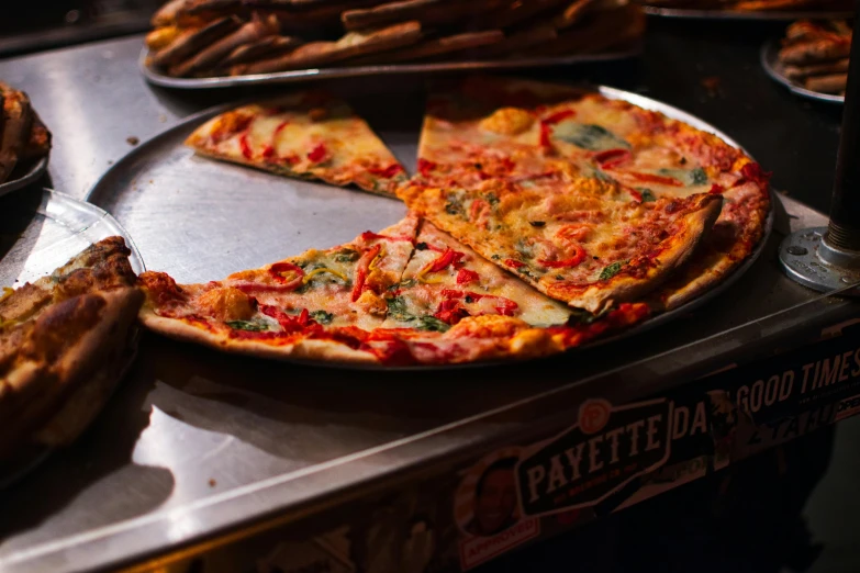 a pizza sitting on top of a pan on top of a table, payne's grey and venetian red, te pae, pastelle, medium angle