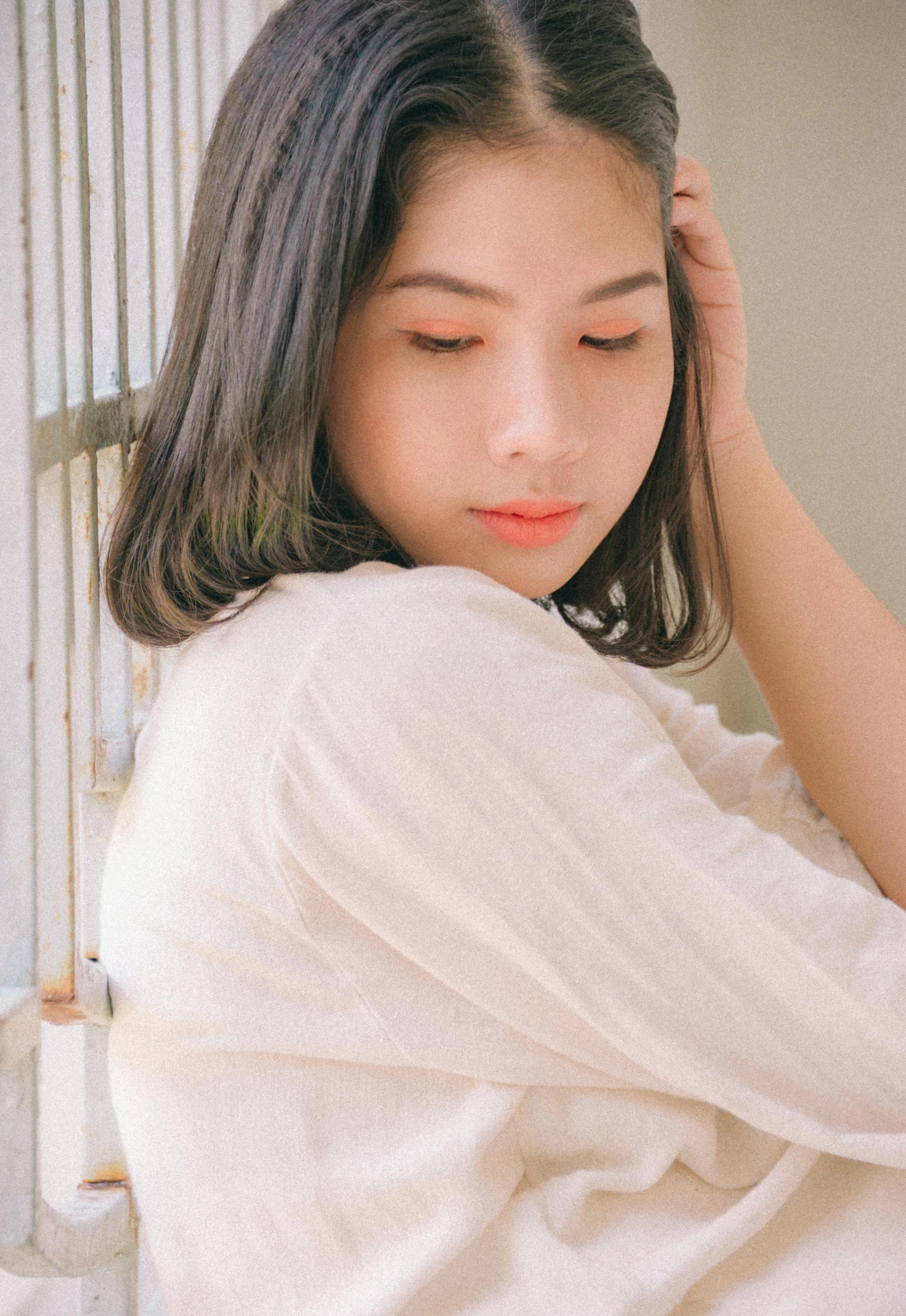 a woman sitting on a bench with her eyes closed, a picture, by Tan Ting-pho, unsplash, realism, wearing a light shirt, 🤤 girl portrait, pastel', indoor picture