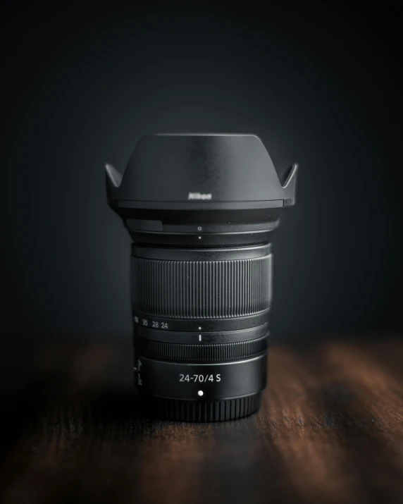 a lens sitting on top of a wooden table, nikon z7, fan favorite, architectural photograph, studio packshot