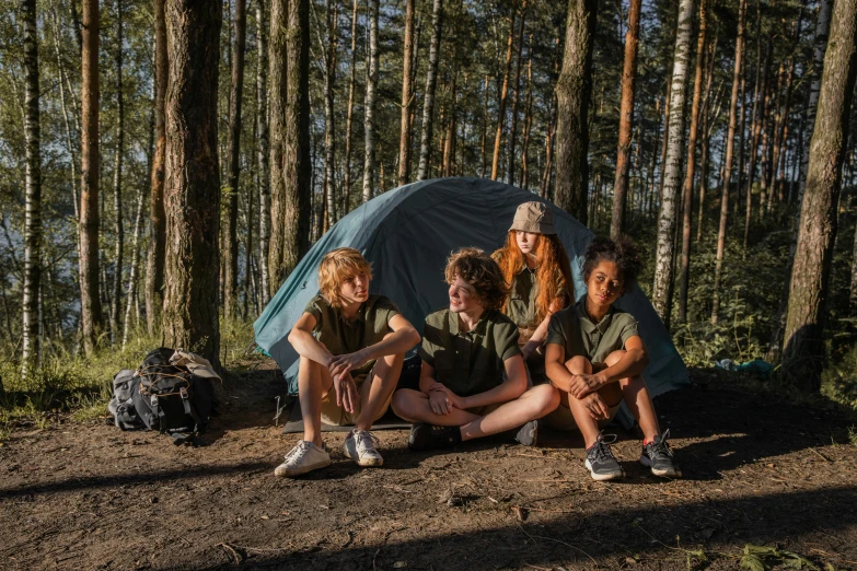 a group of people sitting around a tent in the woods, by Emma Andijewska, pexels contest winner, teenage boy, avatar image, girls, instagram post