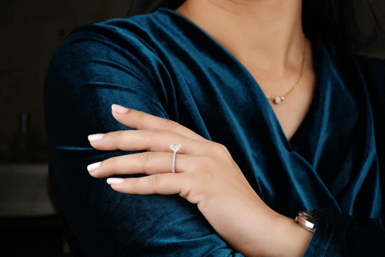 a close up of a person wearing a ring, doing an elegant pose over you, platinum jewellery, thumbnail, middle shot