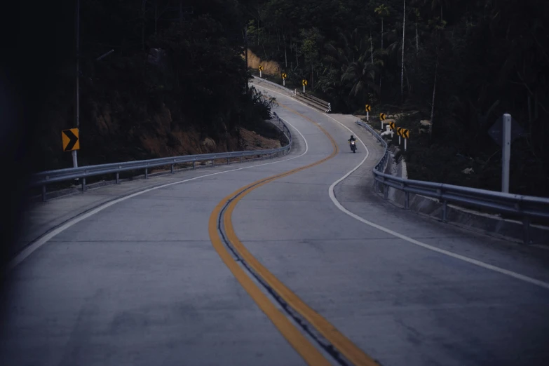 this is an image of a long winding road