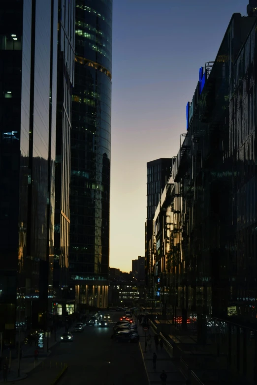 a city street filled with lots of tall buildings, an album cover, pexels contest winner, modernism, predawn, melbourne, reflective glass, backlighted