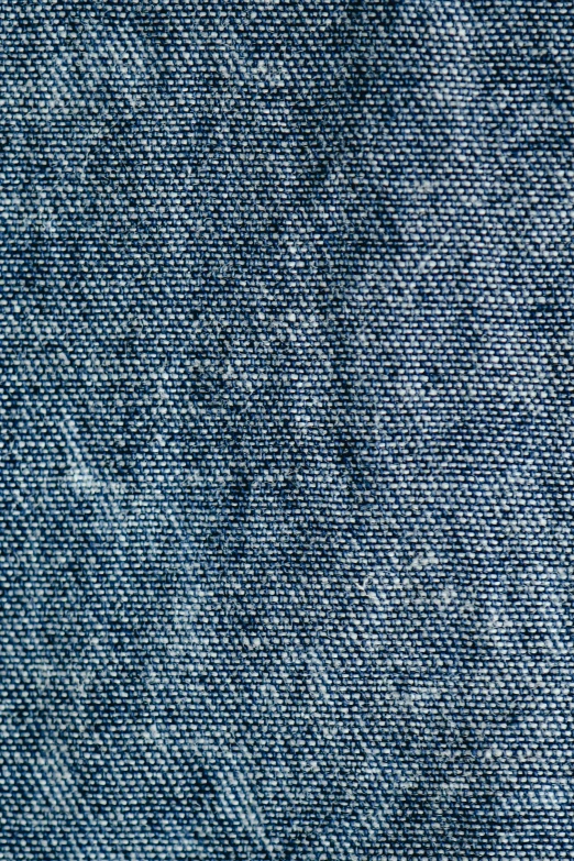 blue jeans fabric with some stitching at the bottom