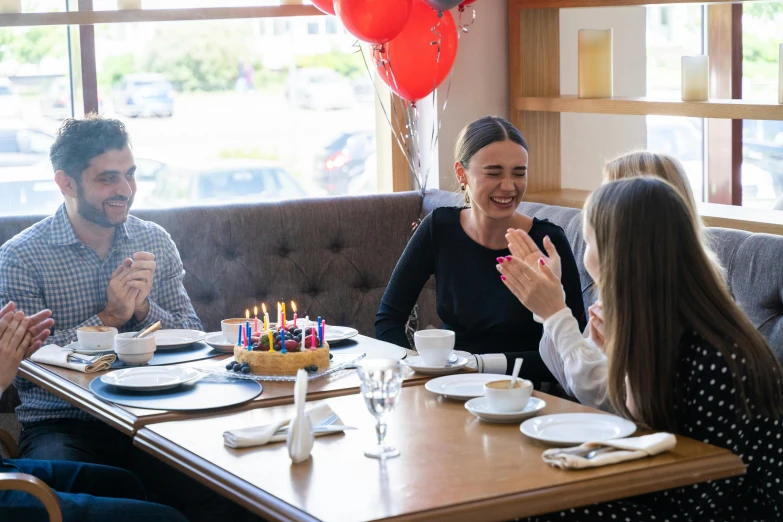 a group of people sitting around a wooden table, birthday, profile image, thumbnail, no blur