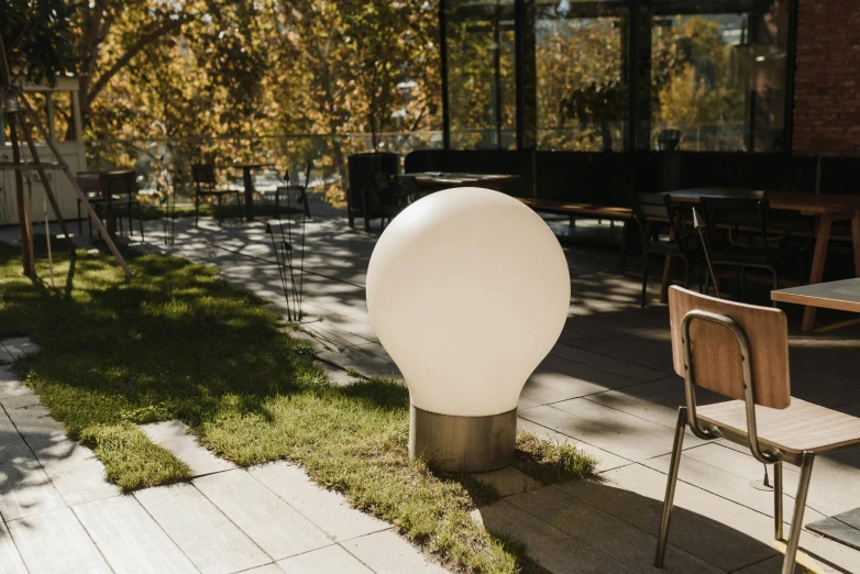 an unusual white orb sitting on the ground