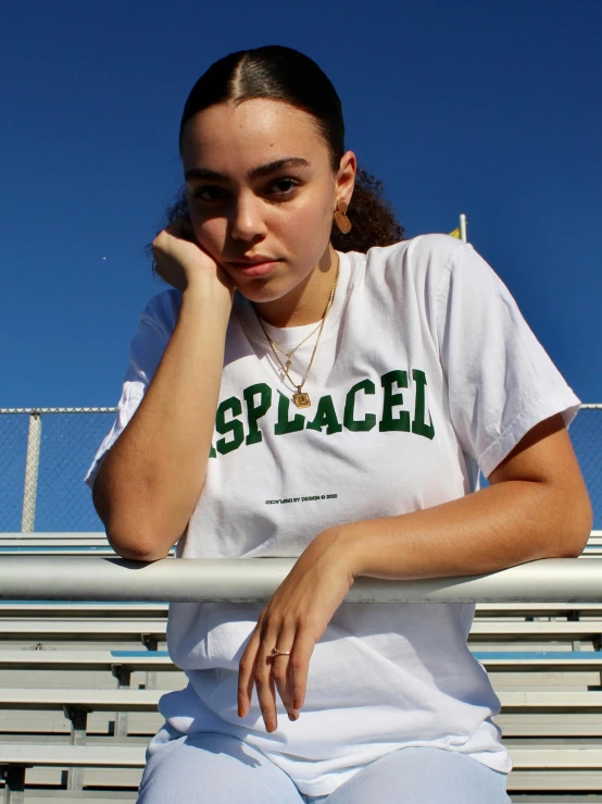 a woman sitting on a blea blea blea blea blea blea blea blea blea blea blea b, an album cover, by Grace Polit, trending on unsplash, happening, sport t-shirt, spacecraft, detailed flawless face, green and white