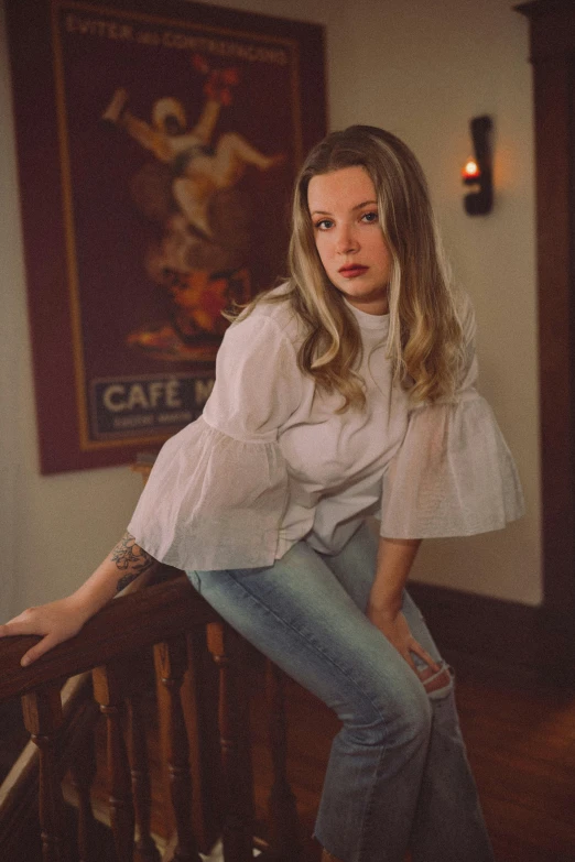 a woman is leaning on a railing