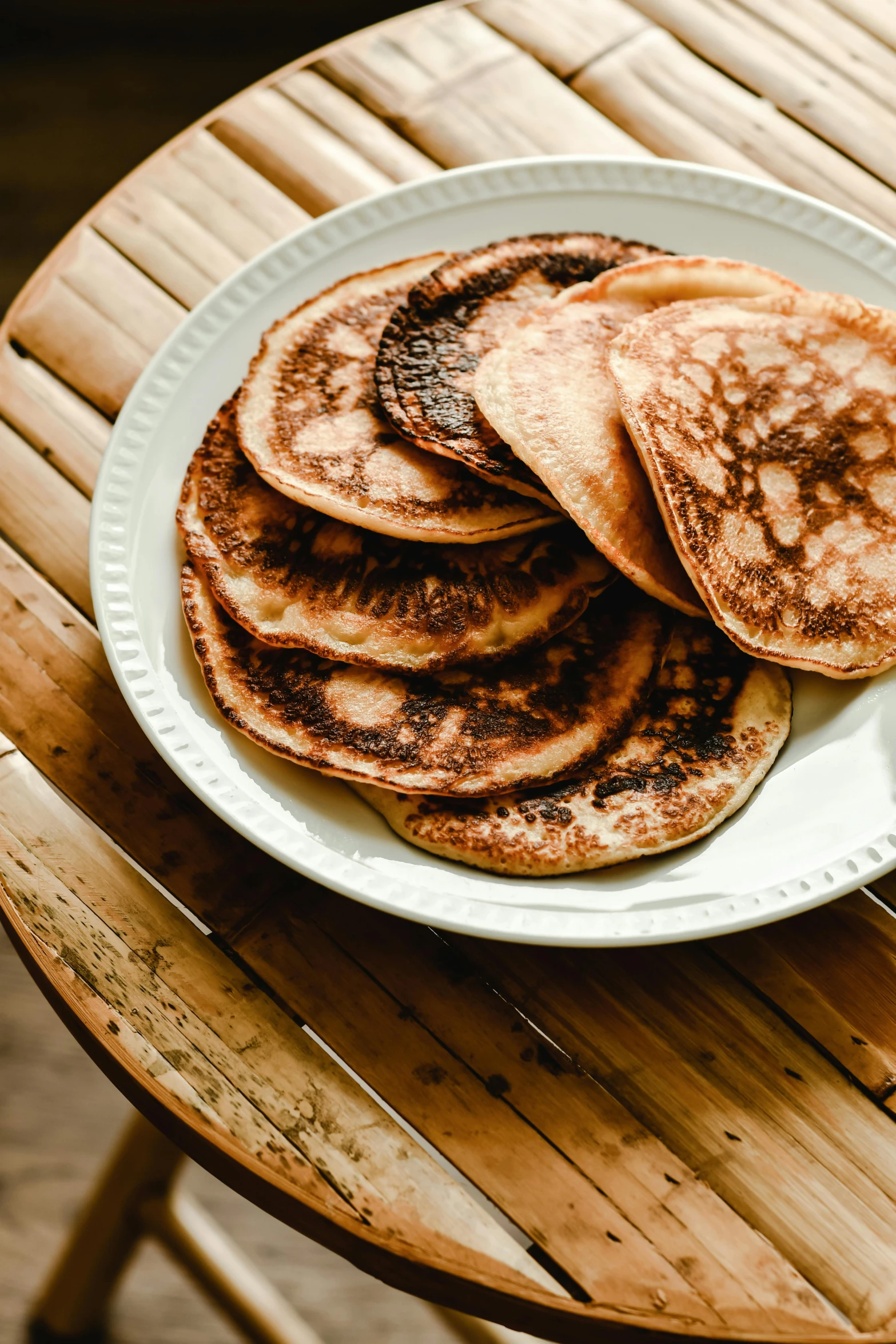 some delicious looking pancakes on a plate on a table