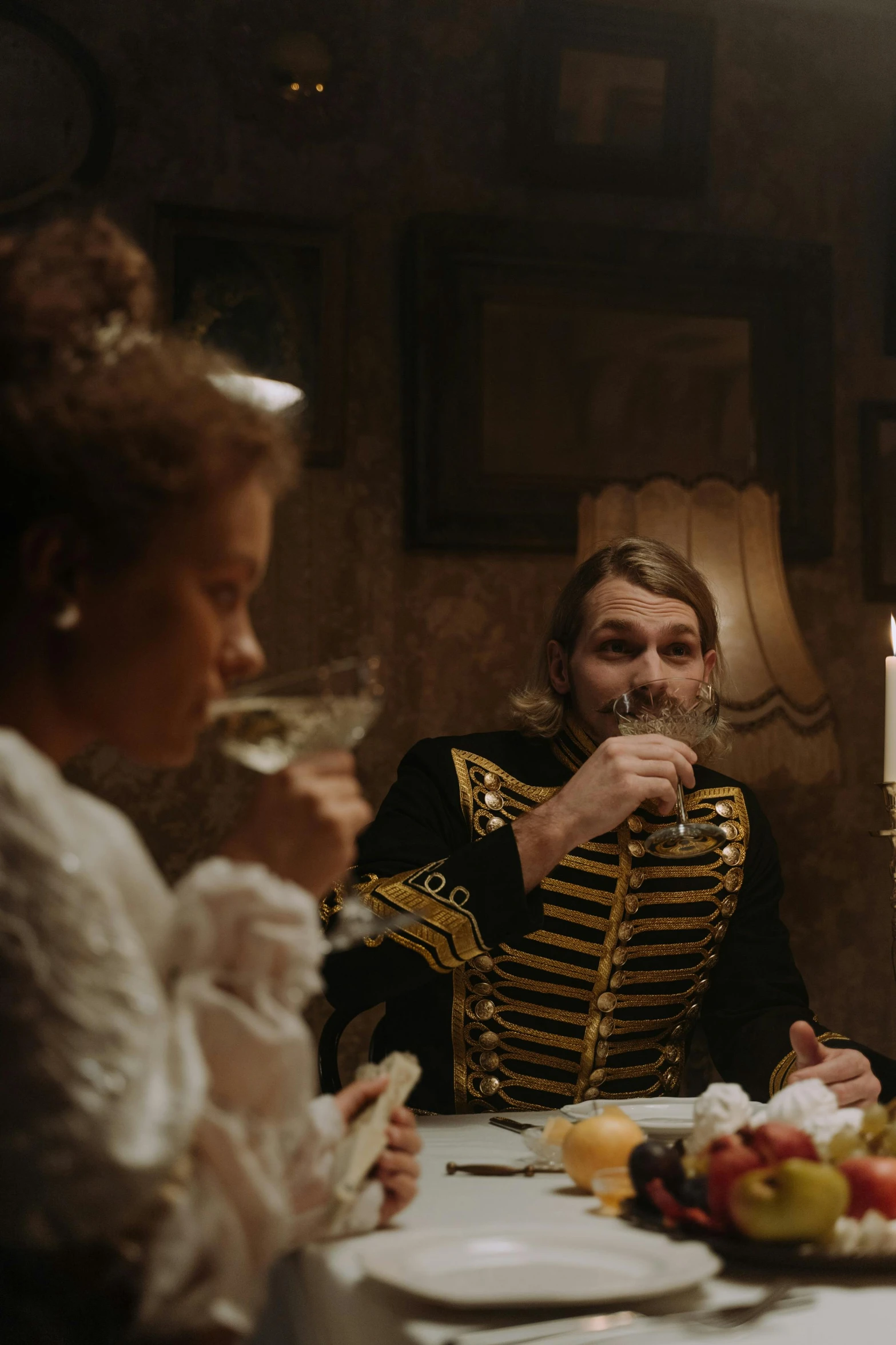 a group of people sitting around a table, inspired by Pietro Longhi, pexels contest winner, rococo, with a male pirate partner, russian cinema, drinking, stillframe