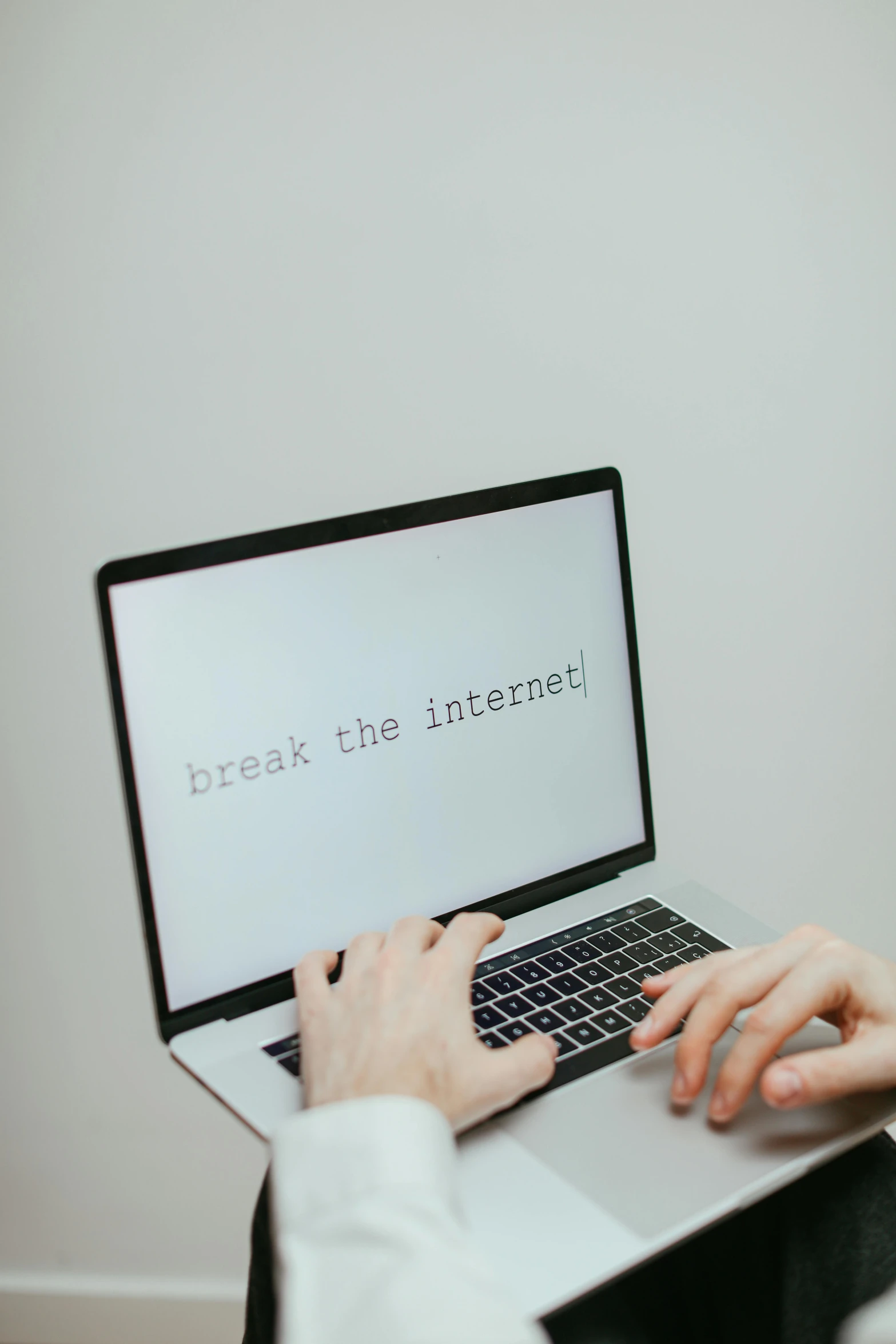 a person typing on a laptop that says break the internet, by Romain brook, trending on pexels, screenshot from game, 15081959 21121991 01012000 4k, instagram picture, centered shot