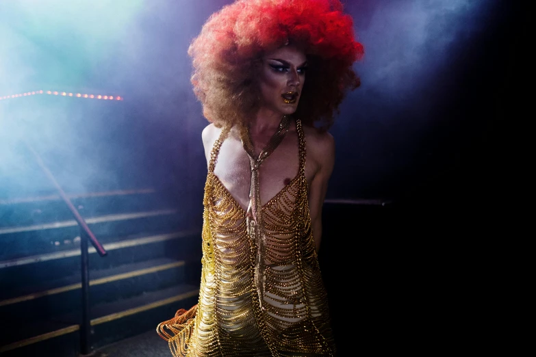 a woman in costume on stage with lights