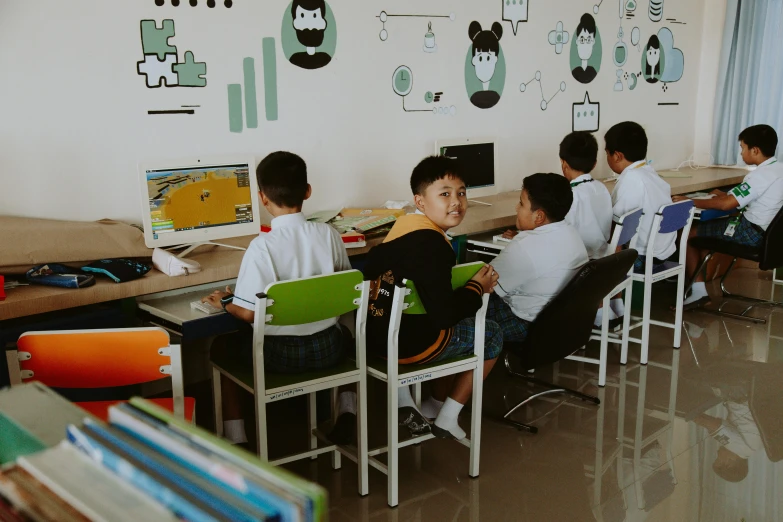 a group of children sitting at desks in front of computers, by Yi Insang, pexels contest winner, pristine and clean design, do hoang tuong artwork, profile image, private academy entrance