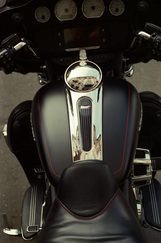 a close up of a motorcycle on a street, chrome cathedrals, black steel with red trim, fan favorite, heat shimmering