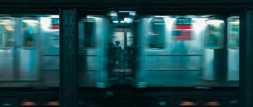 a blurry image of a subway train passing by, inspired by Elsa Bleda, pexels contest winner, teal aesthetic, alessio albi, new york city, ignant