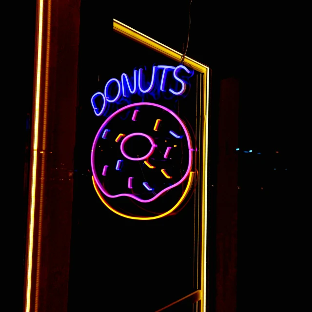 lighted sign above a donut shop for only half the doughnuts