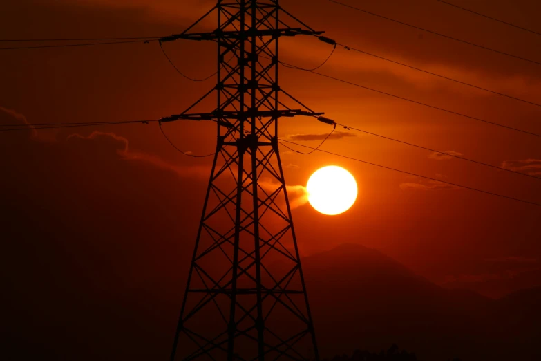 the sun is setting behind an electricity tower, a picture, pexels contest winner, renaissance, orange, dimly lit, red sun, brown