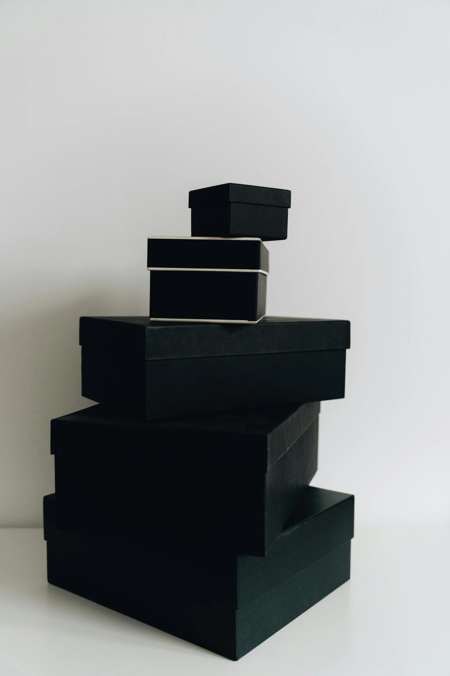 three black boxes stacked on top of each other, pexels contest winner, dwell, curated collections, single color, celebration