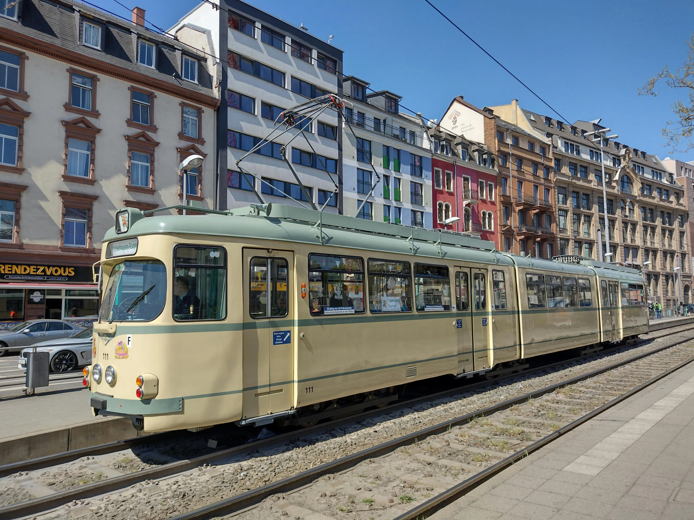 an old train with people traveling on the rails