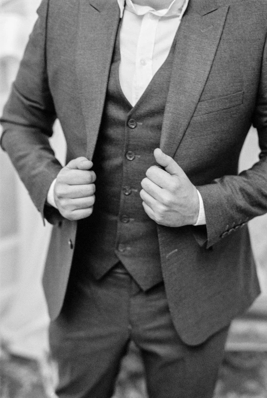 a black and white photo of a man in a suit, by Austin English, pexels, renaissance, three piece suit, no shirt under the vest, morning detail, thick lining