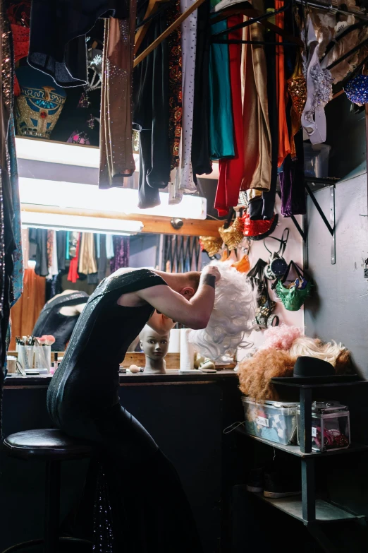 a woman in a shop is looking at some stuff