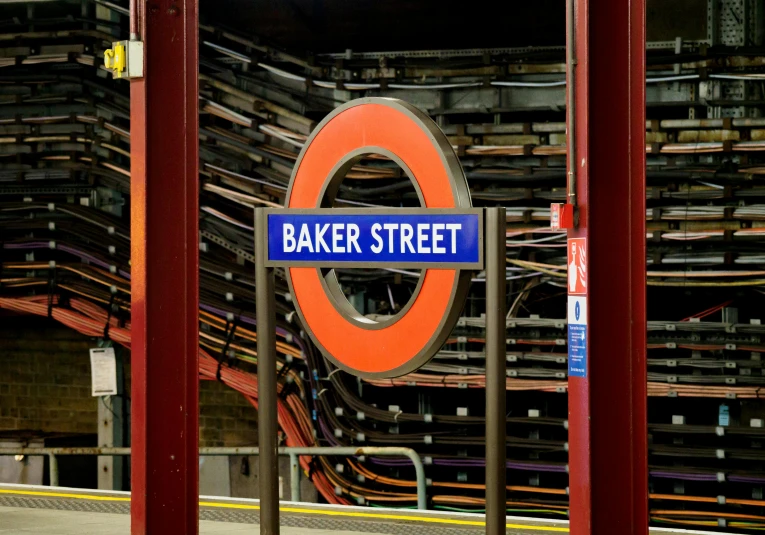 a train station with a sign that says baker street, by David Garner, shutterstock, fan favorite, orange line, circular, norman foster